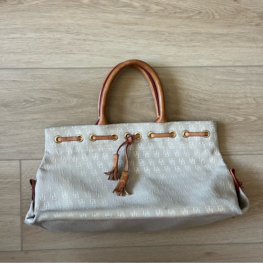 Dooney and Bourke Beige Canvas and Leather Signature Tassel Tote Handbag
